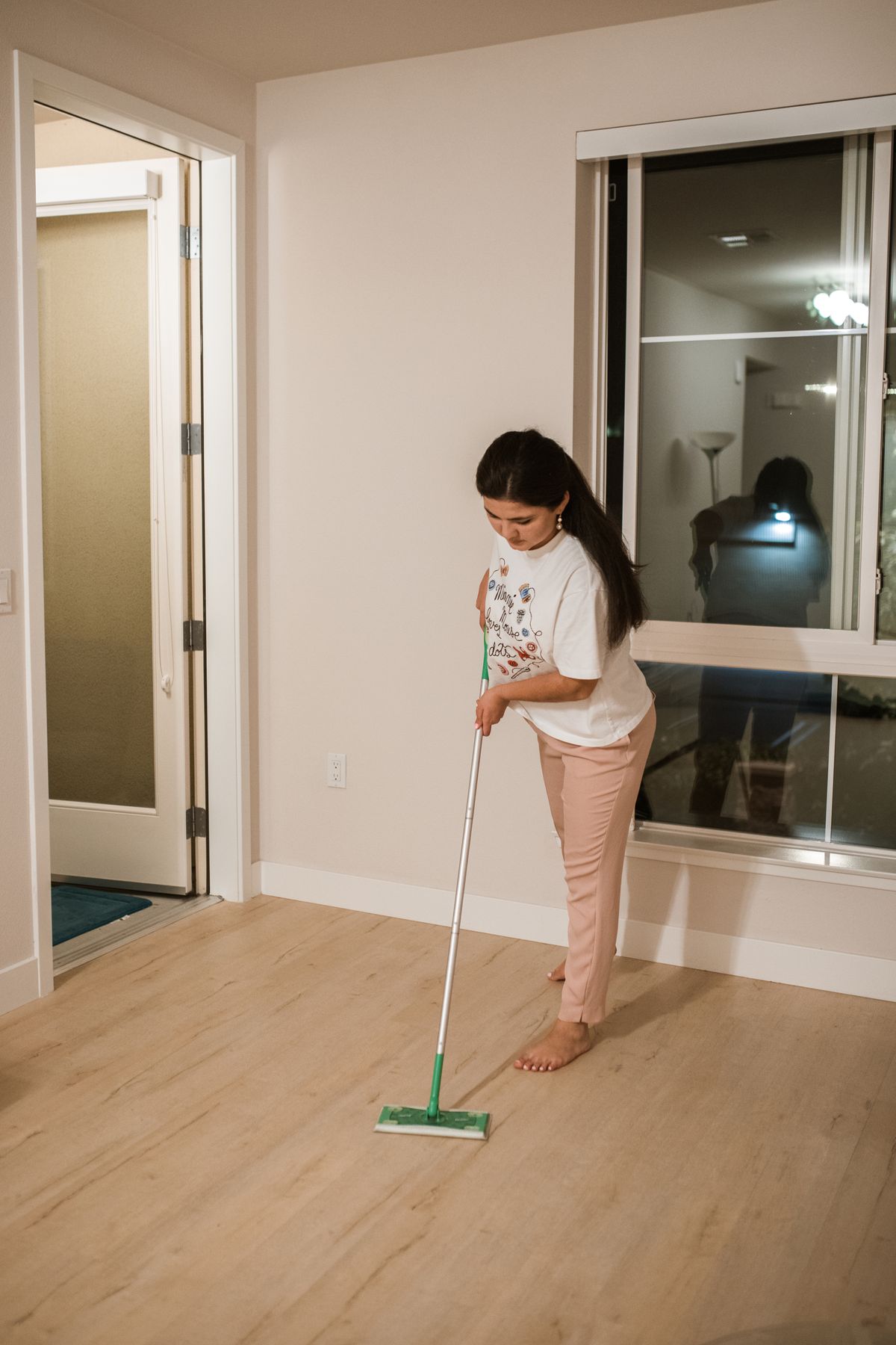 A person cleaning a floor