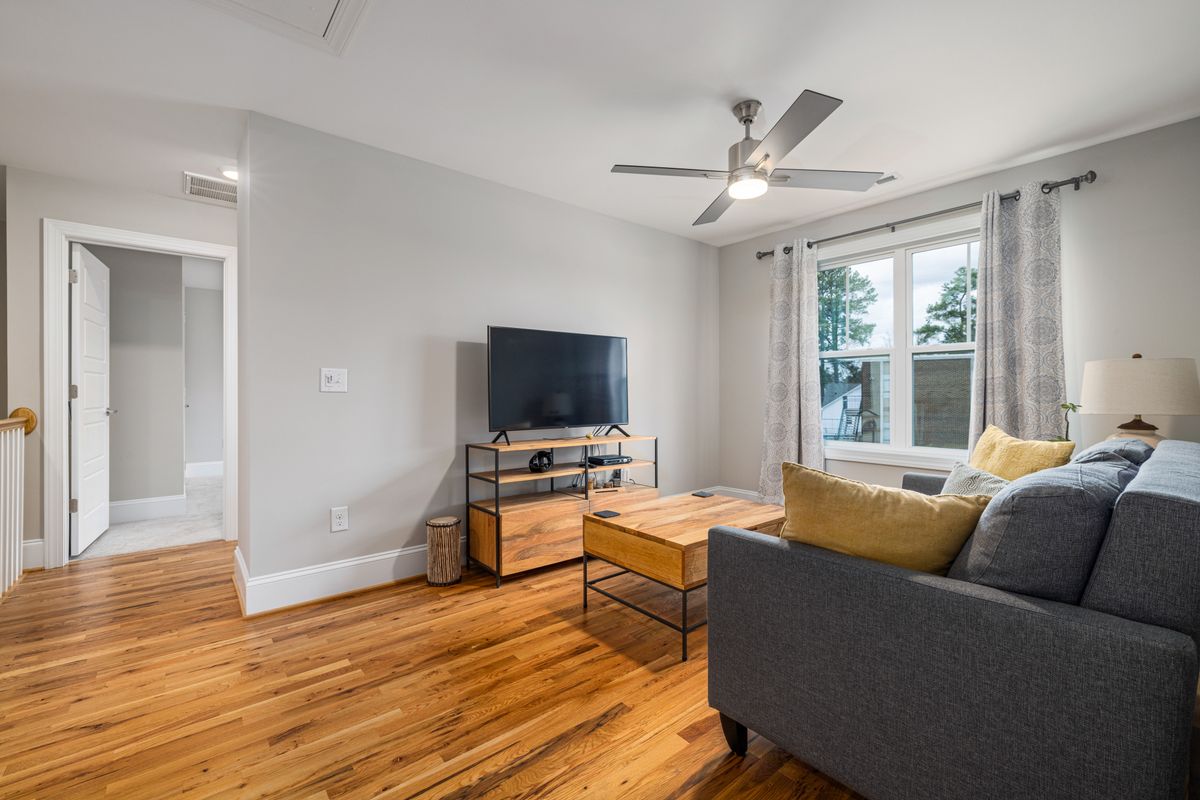 A living room with wood flooring